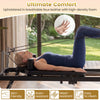 Foldable Pilates reformer machine in black, featuring breathable faux leather and high-density foam for ultimate.