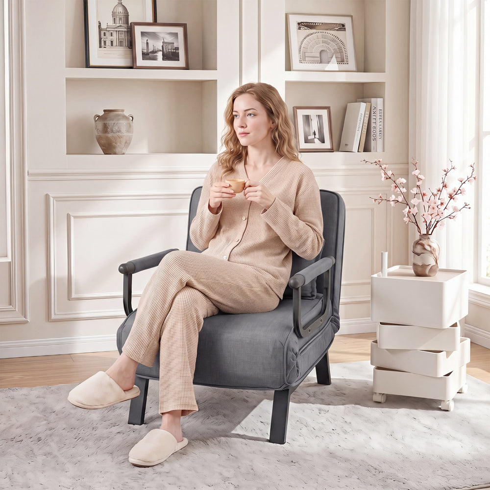 Convertible gray armchair with a 6-position adjustable backrest, perfect for lounging or sleeping in any room.