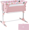 Folding baby bassinet bedside sleeper in pink with adjustable height, detachable side rail, and included carry bag.