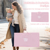 Folding baby bassinet in pink with a carry bag, featuring adjustable heights for bedside or standalone use.