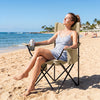 Folding camping chair with a mesh backrest, solid metal frame, and cup holder, ideal for beach relaxation.