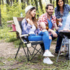 Folding camping chair with cup holder and lumbar pillow, designed for comfort and stability during outdoor gatherings.