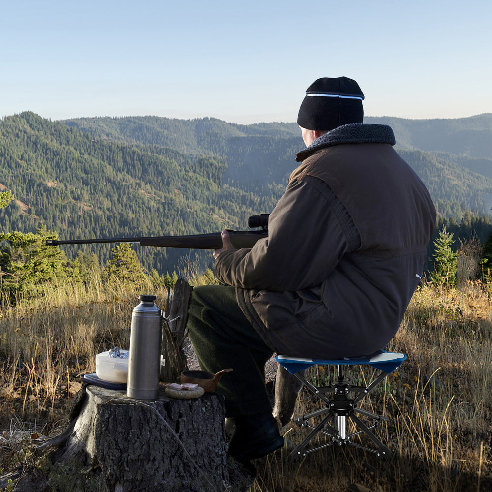 Folding camping stool in blue with 360° swivel, sturdy metal frame, and anti-sink feet, perfect for outdoor activities.