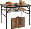 Folding camping table in black and brown with adjustable height, storage net, and handle, ideal for outdoor use.