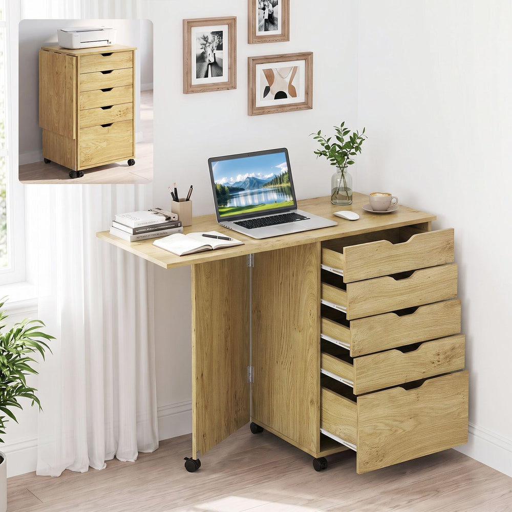 Folding desk with storage drawers in natural finish, featuring five drawers and wheels for easy mobility in small spaces.