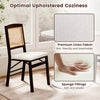 Folding dining chair with a rubber wood frame, linen padded seat, and rattan backrest, ideal for kitchen or dining room.