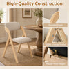 Folding dining chair with cushioned seat, solid rubber wood frame, and ergonomic design for comfortable seating.