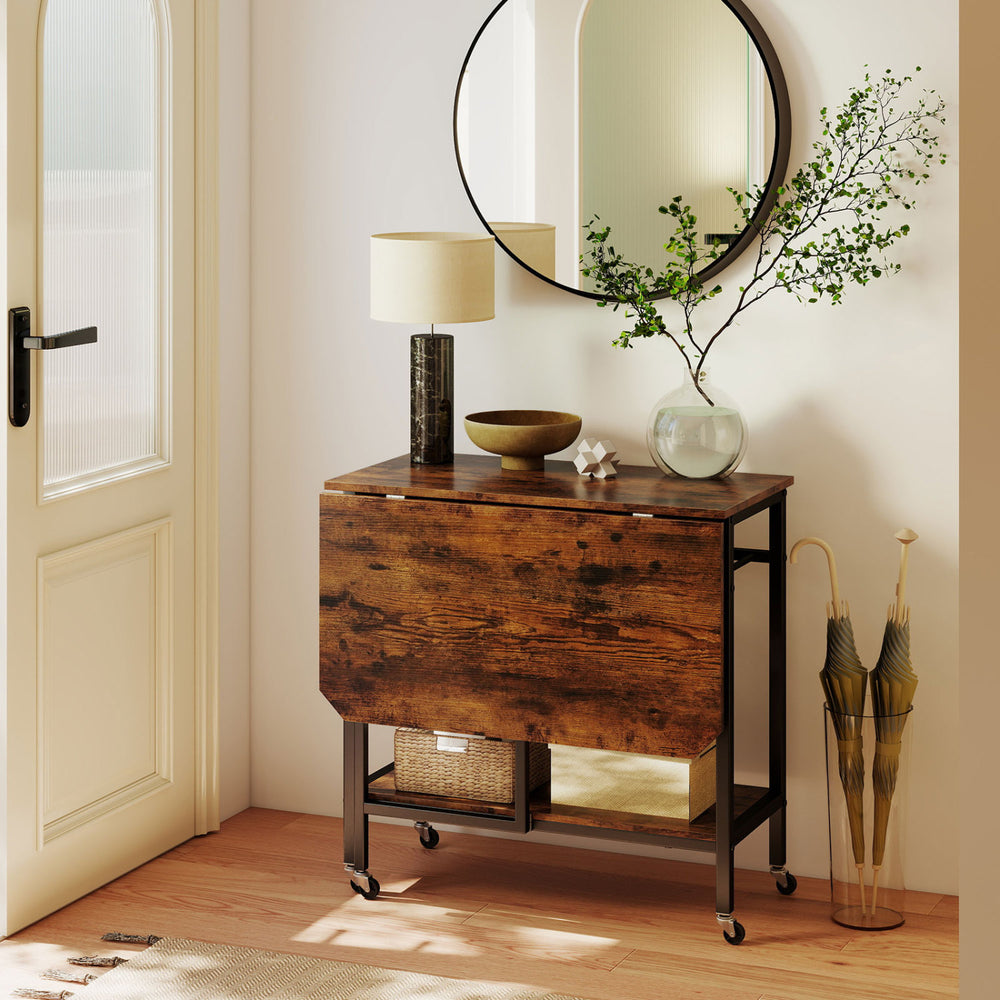 Folding dining table in rustic brown with expandable top, wine rack, and wheels, perfect for small spaces.