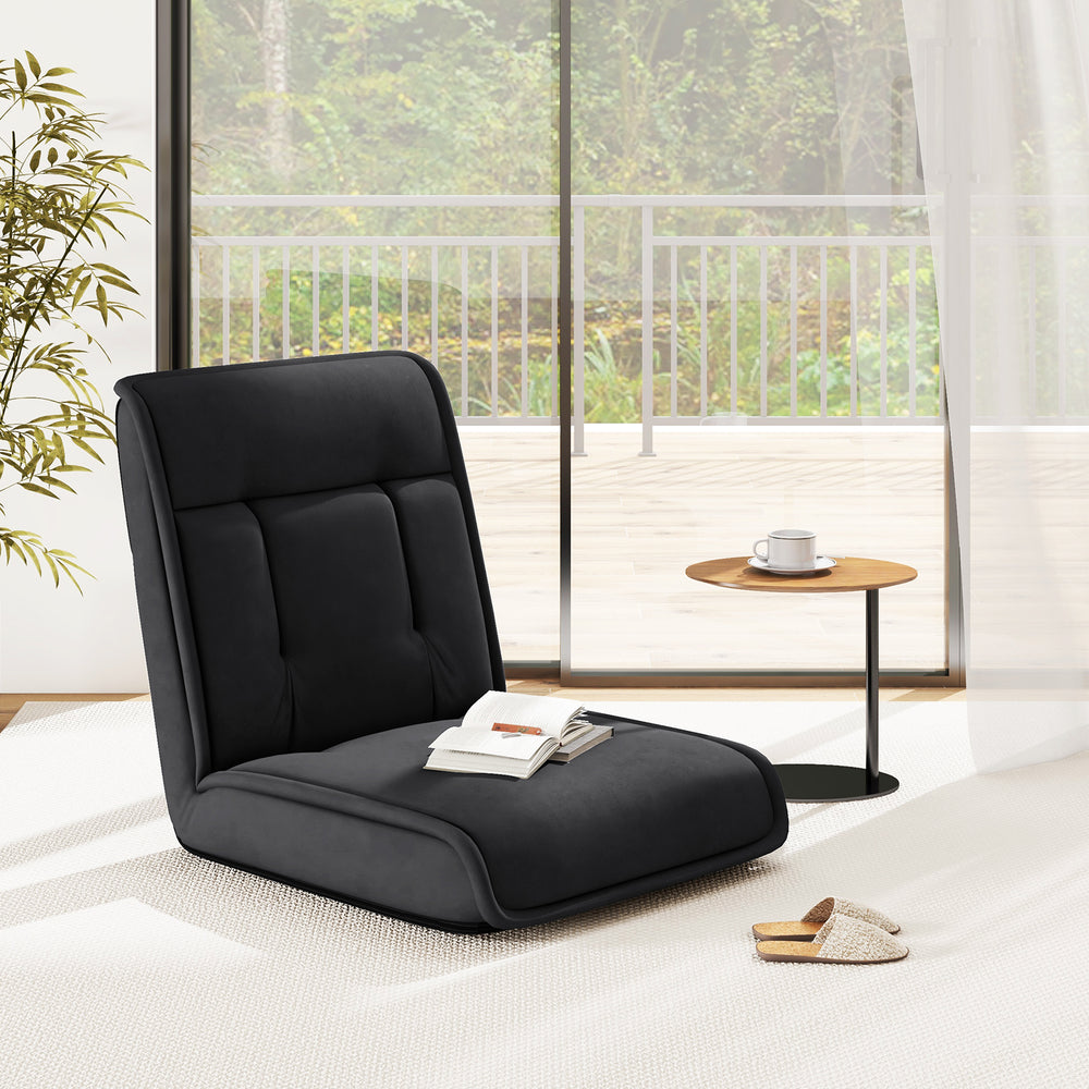 Black folding floor chair with adjustable backrest, ideal for gaming, reading, or napping in any space.