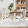 Set of 2 white folding kitchen chairs with upholstered padded seats, ideal for dining and easy storage.