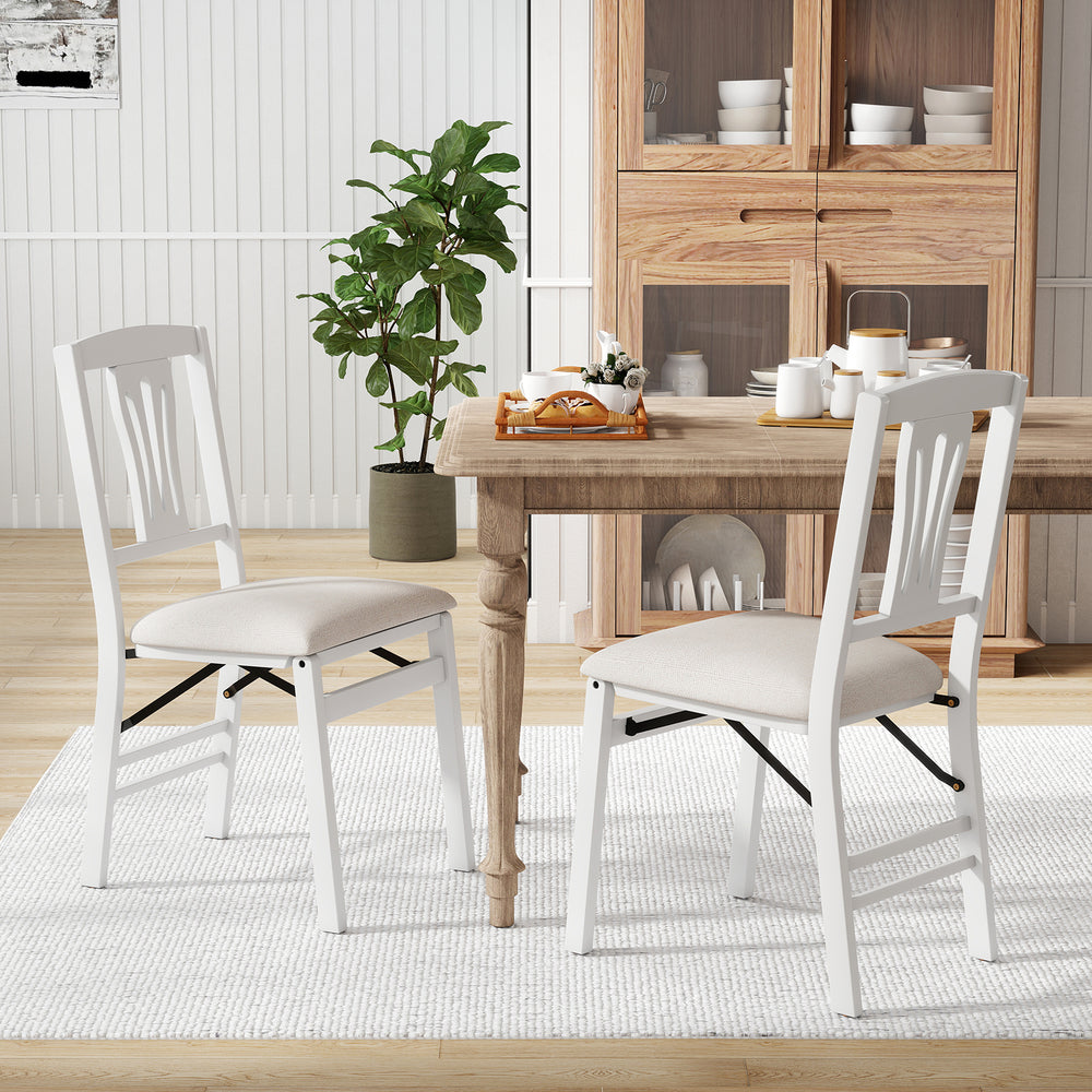 Set of 2 white folding kitchen chairs with upholstered padded seats, ideal for dining and easy storage.