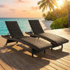 Set of 2 folding padded rattan chaise lounges with adjustable backrests, perfect for poolside relaxation and easy storage.