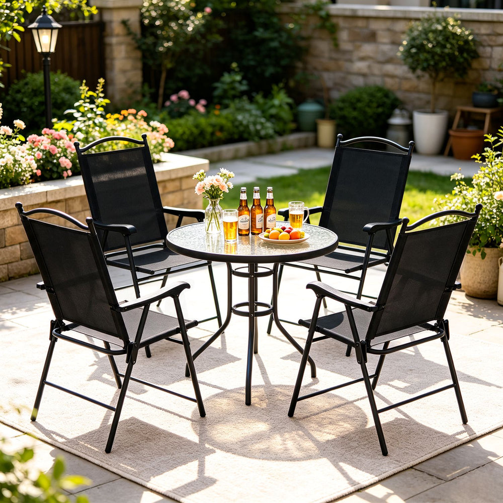 Set of four black folding patio chairs with high backs and armrests, perfect for outdoor relaxation in any garden or deck.