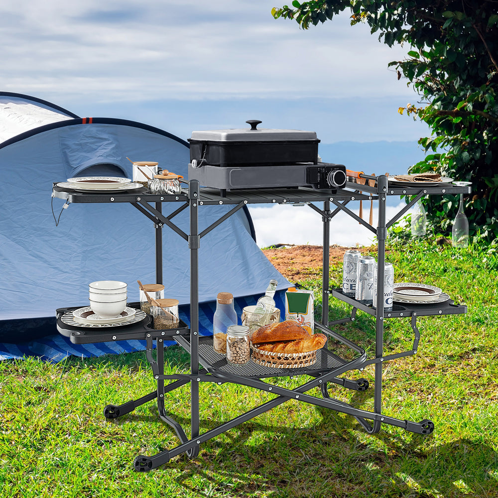 Folding portable outdoor cook station with heat-resistant aluminum tabletop, showcasing a spacious cooking area and.