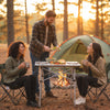 Folding roll-up camping table with metal legs set up for outdoor dining, perfect for camping and picnics.