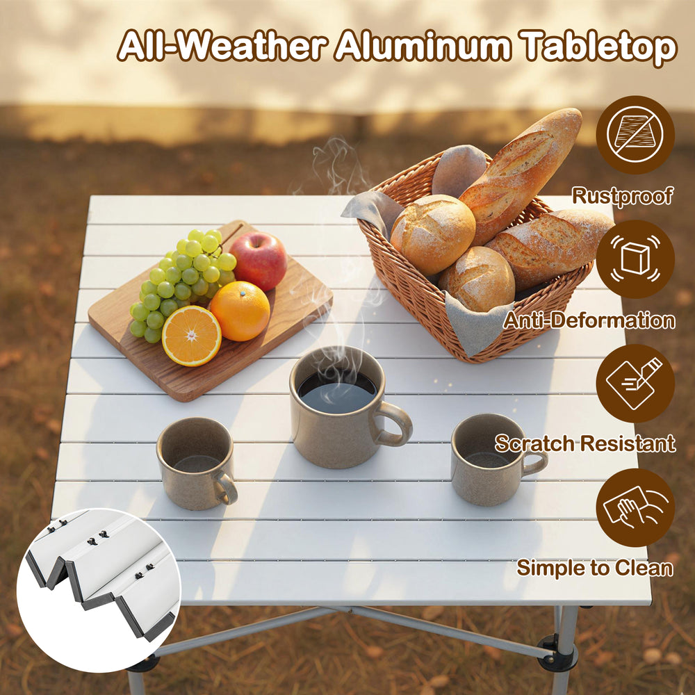 Folding roll-up camping table with all-weather aluminum tabletop, featuring a silver finish and ideal for outdoor use.