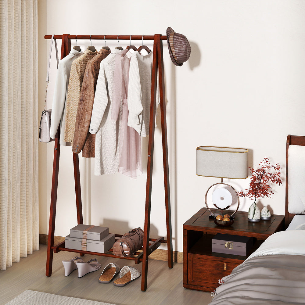 Folding rubber wood clothes hanging rack in walnut with bottom storage shelf, perfect for bedroom or hallway.