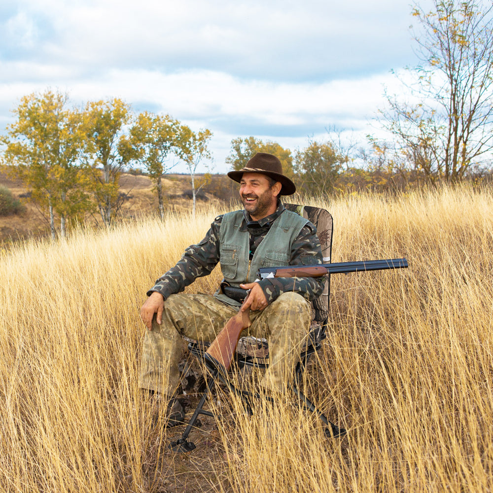 Swivel folding chair featuring a high backrest and padded cushion in camouflage, perfect for relaxed outdoor hunting.