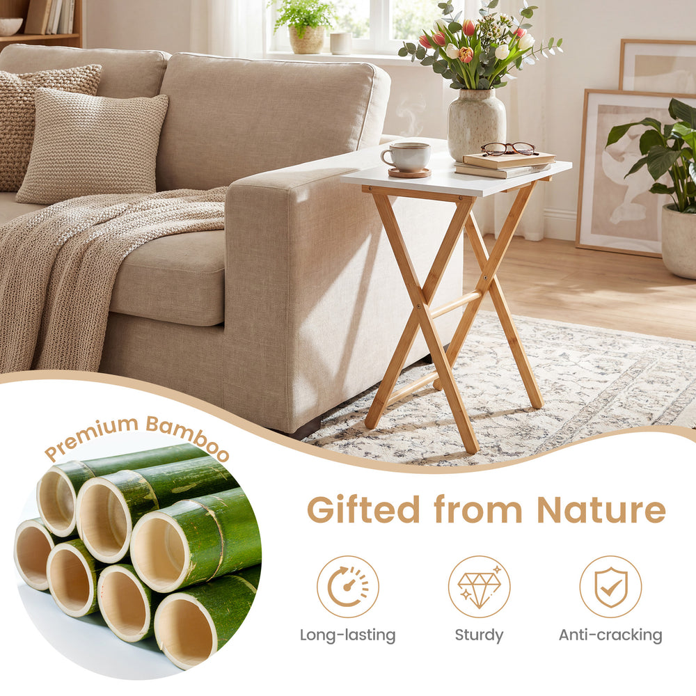 Folding TV tray table in white with premium bamboo structure, sturdy design, perfect for small spaces in living rooms.