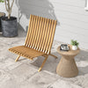 Folding teak wood outdoor lounge chair with slatted seat, perfect for patio relaxation and compact storage.