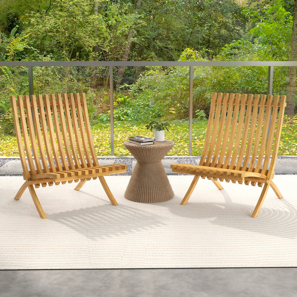 Two folding teak wood outdoor lounge chairs with slatted seats and backrests, perfect for patio relaxation.