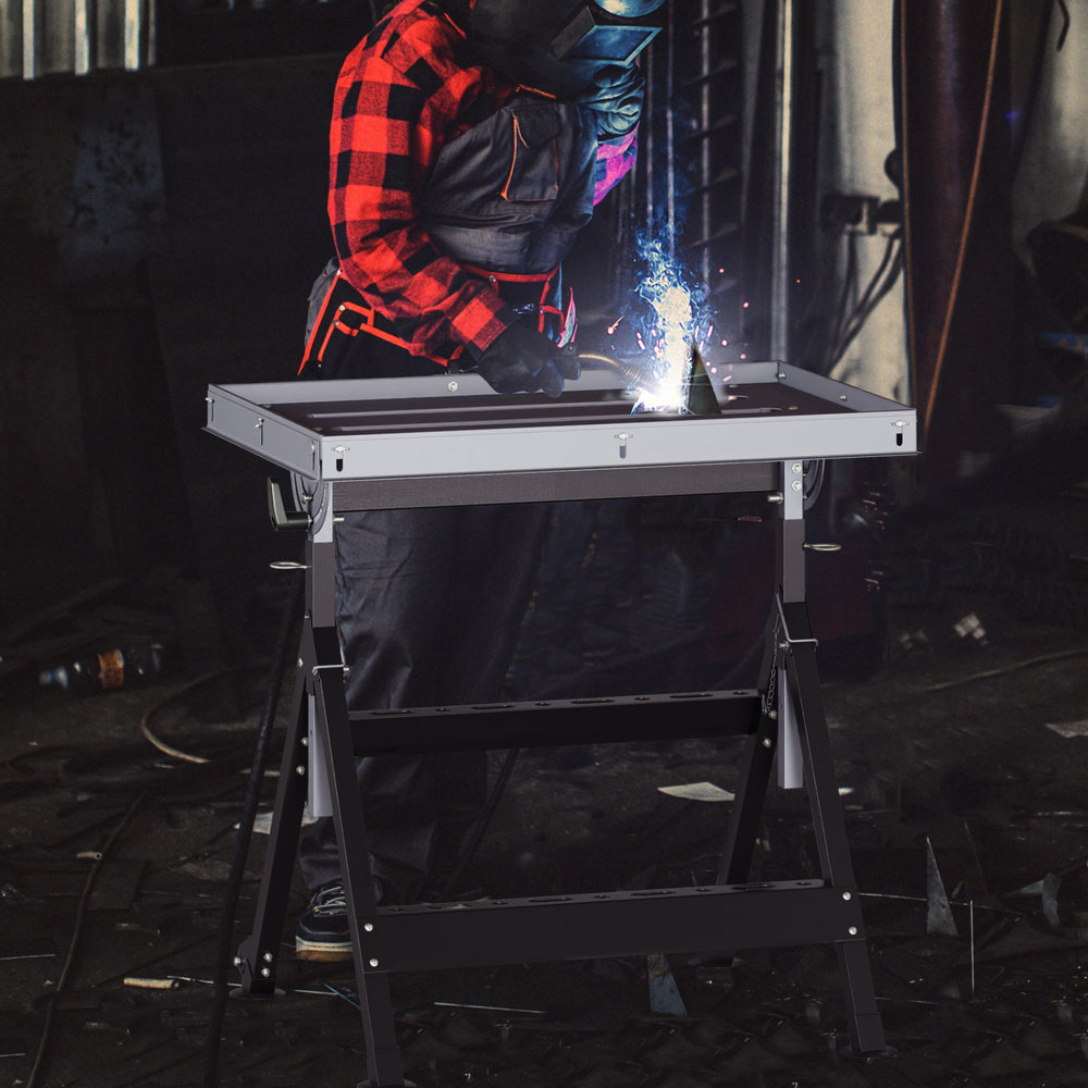 Folding welding table with a tiltable tabletop, 4-level height, and wheels for easy mobility in a workshop setting.