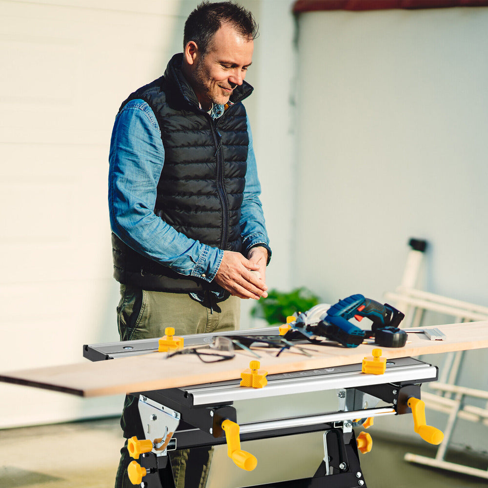 Folding work table with adjustable height and tiltable platform, featuring clamps and sturdy aluminum construction for.