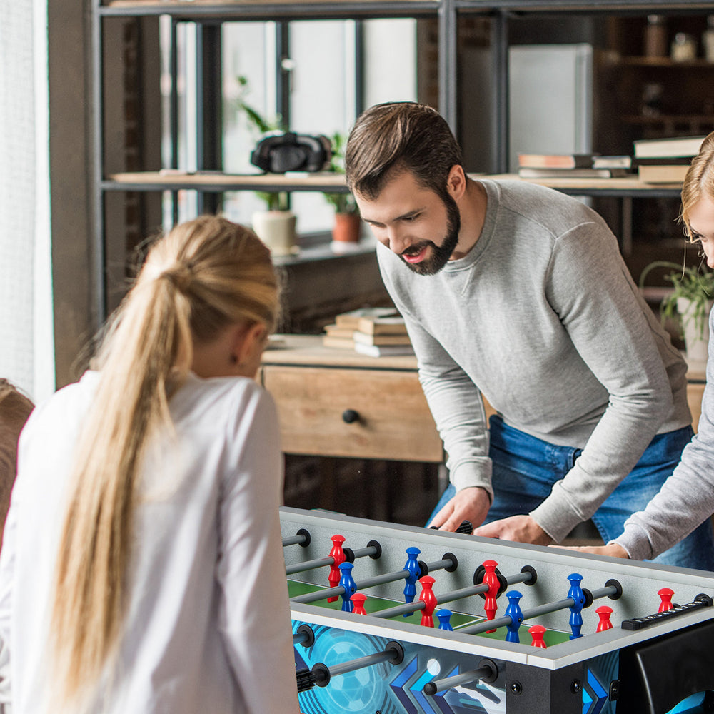 Stable soccer table game with players enjoying gameplay, featuring realistic players and sturdy construction for all.