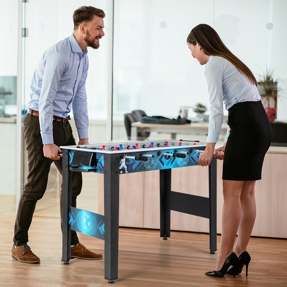 Stable soccer table game featuring two players in action, promoting fun and coordination for all ages in an office.