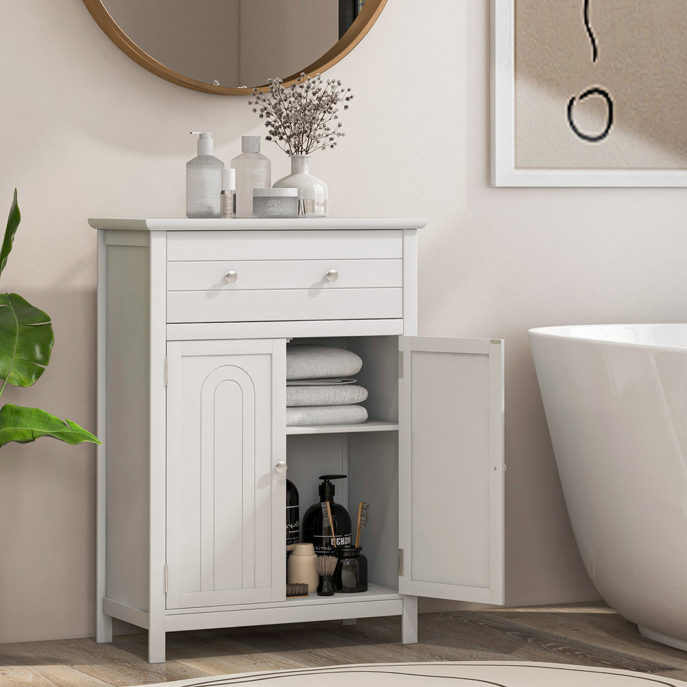Free standing bathroom storage cabinet featuring an open door view with neatly stacked towels and stylish bathroom.