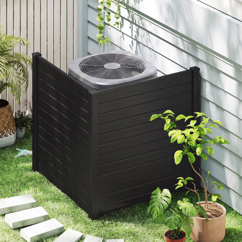 Freestanding black air conditioner fence with metal stakes, providing privacy and stability for outdoor units and.