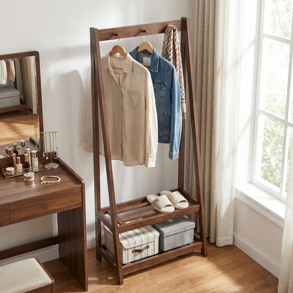 Freestanding clothes rack in walnut with 3 hooks and 2 shelves, perfect for bedroom or entryway organization.