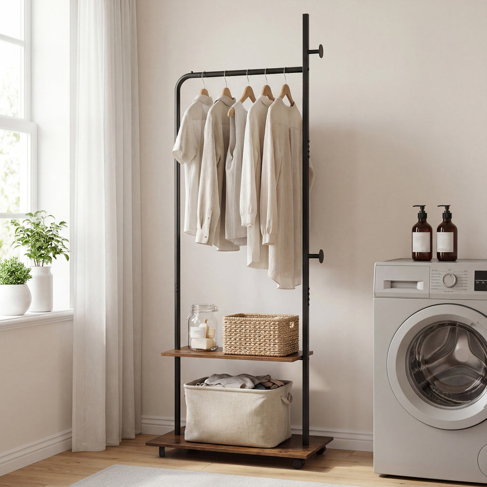 Freestanding clothing rack with wheels, rustic brown shelves, and hanging rod for organized entryway or bedroom storage.