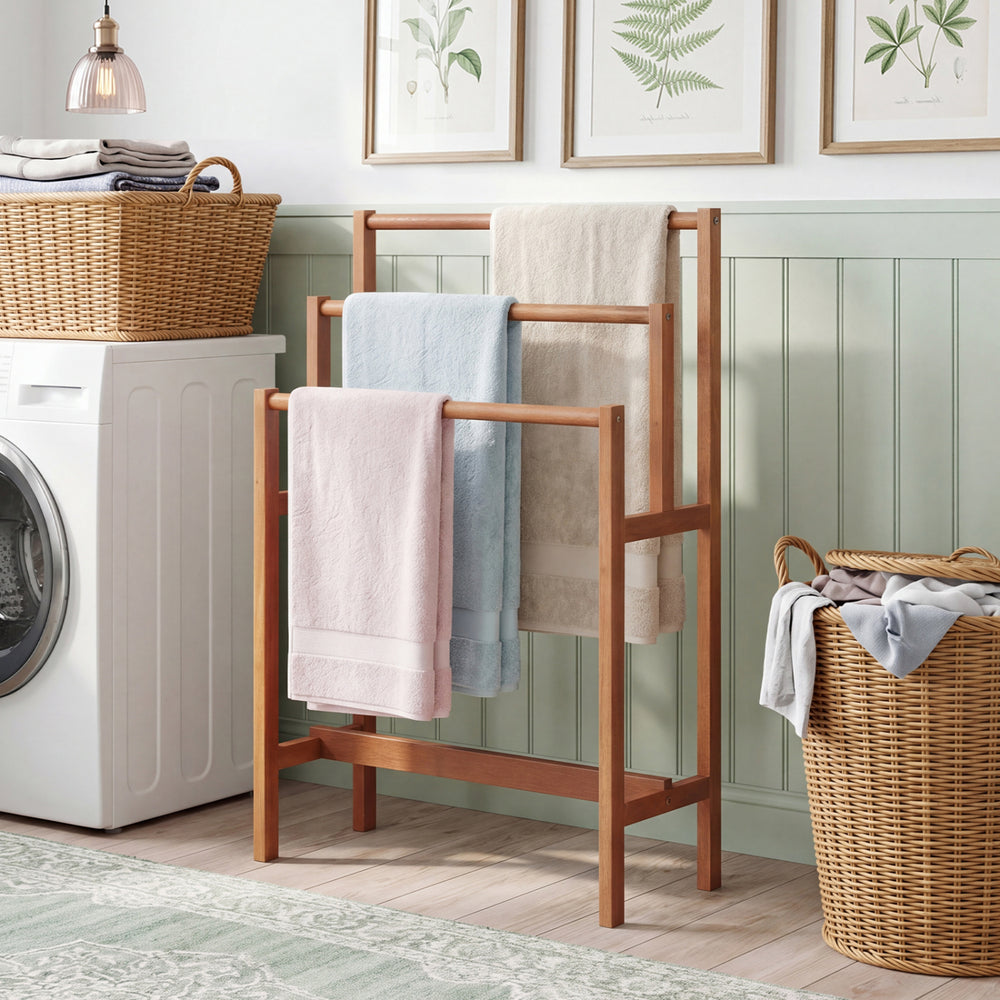 Freestanding wooden towel rack with a teak oil finish, featuring open spacing for ventilation and quick drying in any.