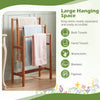 Freestanding solid wood towel rack with teak oil finish, featuring large hanging space for towels and blankets.
