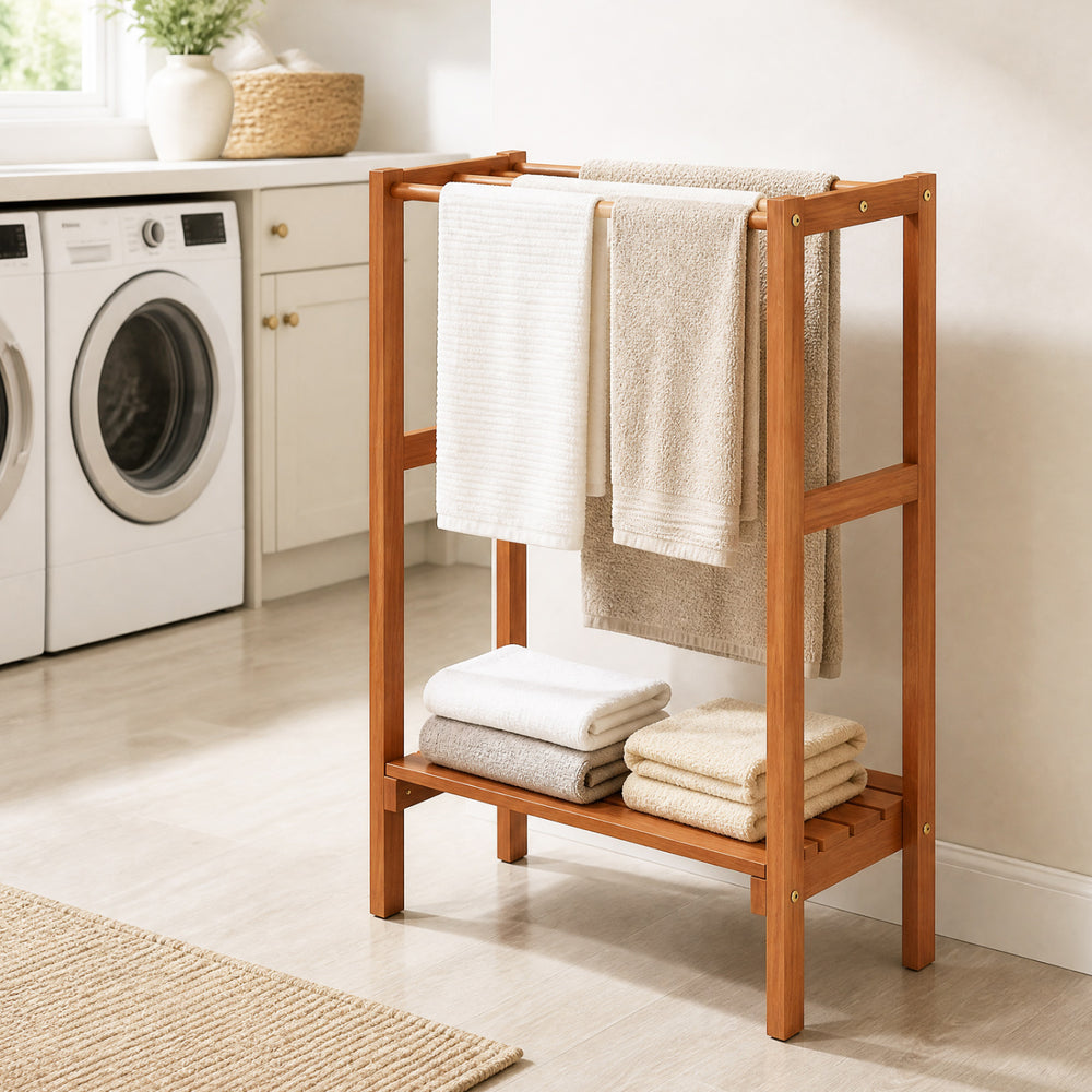 Freestanding towel rack showcasing a smooth wood surface with three hanging bars and a sturdy bottom shelf for towels.
