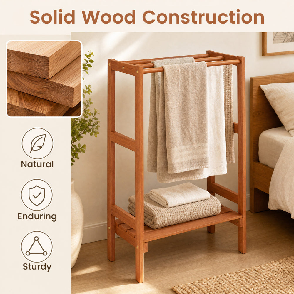 Freestanding towel rack with solid wood construction, featuring three hanging bars and a bottom shelf for extra storage.