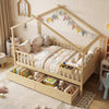 House-shaped full-size bed with fence rails and storage drawers, made of solid wood for kids' imaginative play.