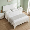 Modern platform bed frame in white featuring a mid-century headboard, wooden slat support, and 6" under-bed storage space.