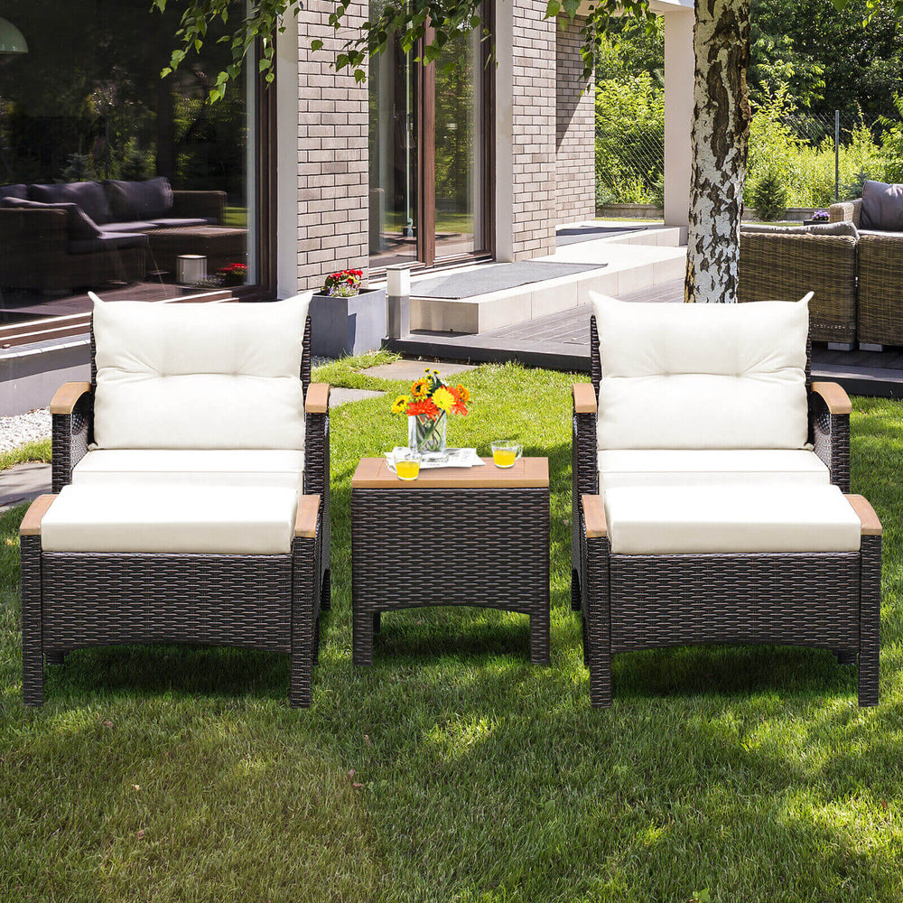 Two comfortable patio chairs with white cushions and a coffee table, made of acacia wood and PE rattan, ideal for.