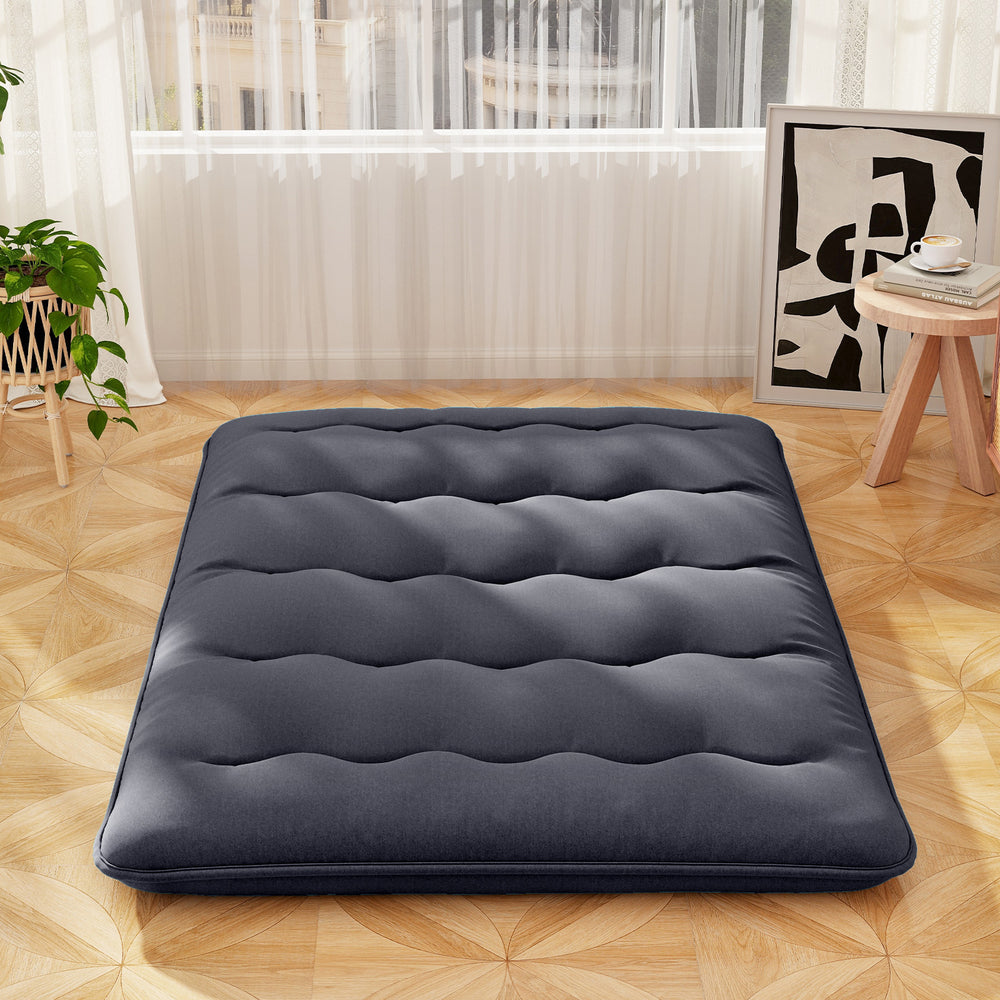 Futon mattress in navy with quilted design, perfect for camping, yoga, or as a kid's play mat, featuring a washable.
