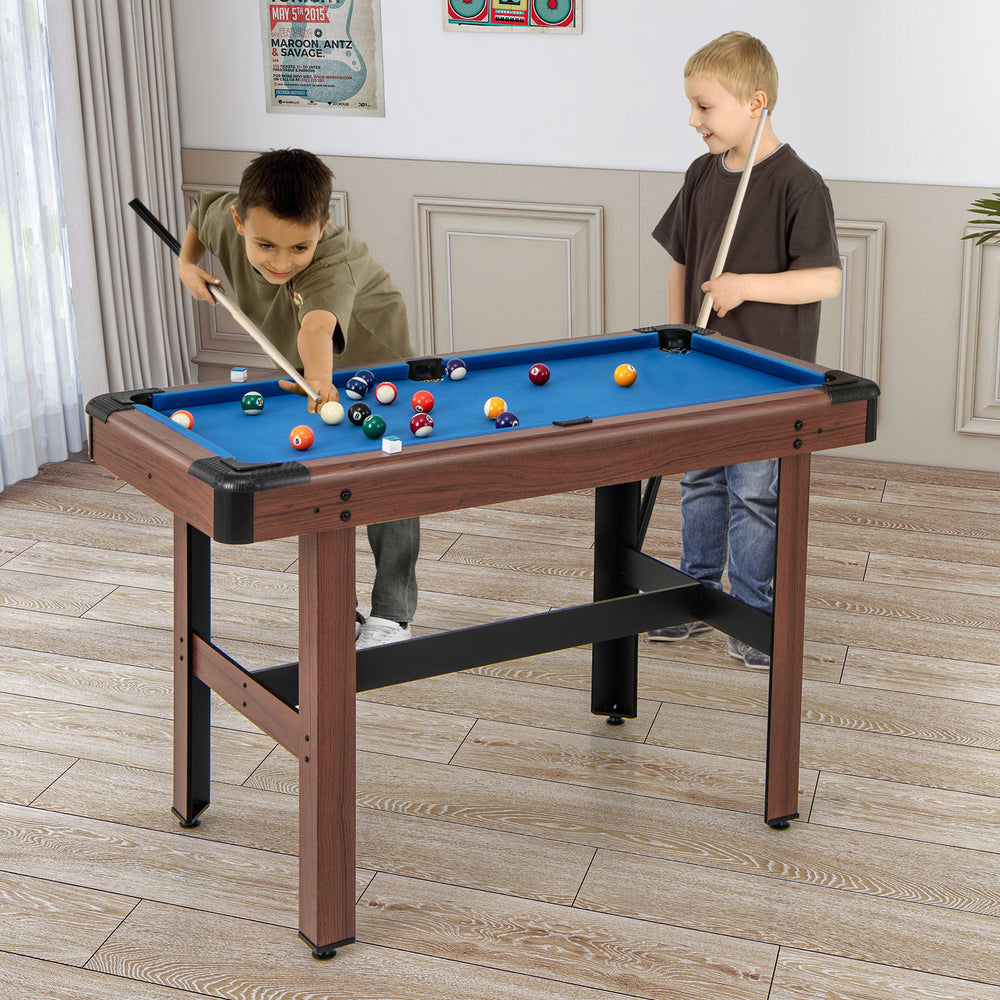 Kids playing on a 48-inch blue pool table with wooden frame, featuring a full set of balls and cue sticks for family.