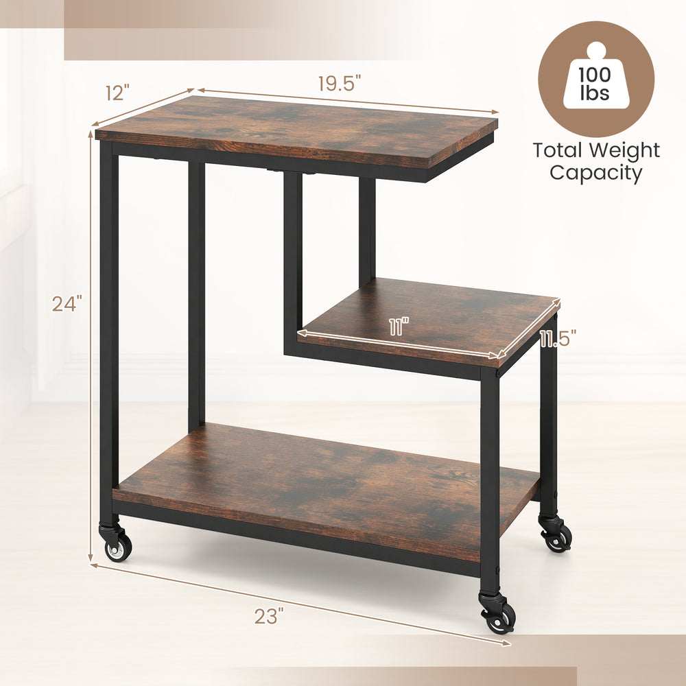 G-shaped side table with rustic brown finish, featuring 3 tiers and wheels for mobility, ideal for living room or.