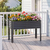 Galvanized raised garden bed with legs, 46"x24"x31", featuring vibrant flowers and ergonomic height for easy gardening.