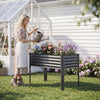 Galvanized raised garden bed with legs, 46" x 24" x 31", ideal for planting flowers and vegetables in a backyard.