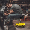 Height adjustable yellow rolling garage stool with tool tray storage, featuring a padded seat and universal wheels for.