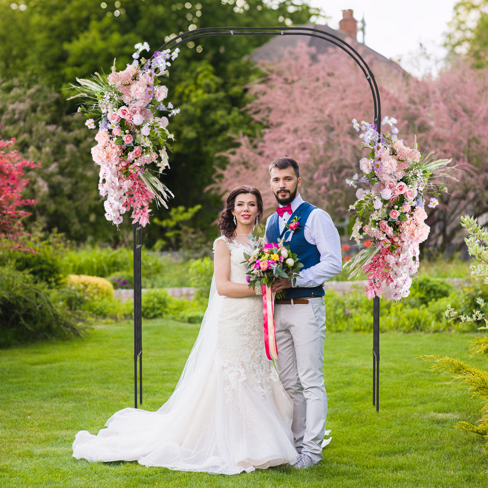 Outdoor metal garden arch trellis with floral decorations, perfect for weddings and climbing plants in the garden.