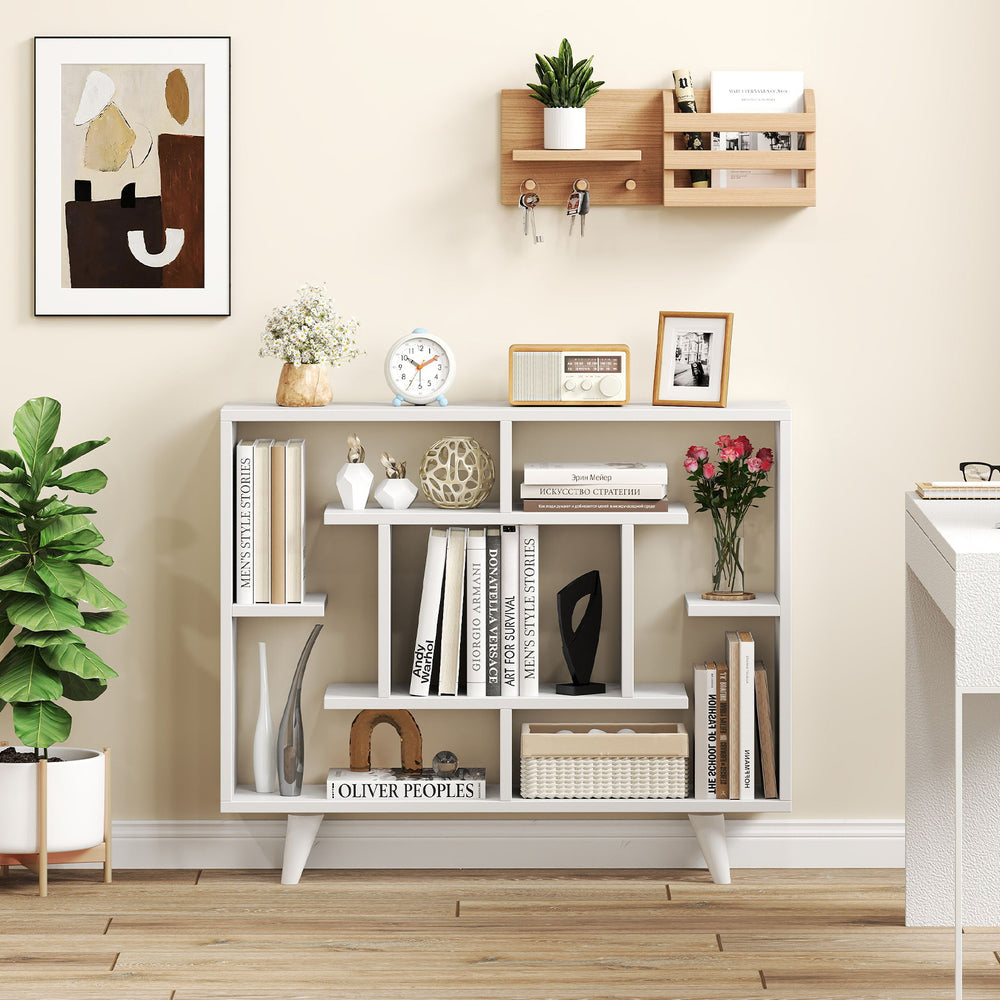 Geometric white bookcase with multiple shelves, anti-tipping kit, and stylish design for living room or office storage.