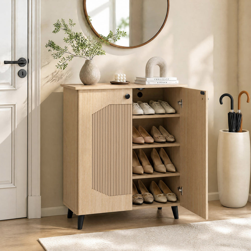 Geometric cabinet with hollow-out door panels and convenient handles, providing stylish footwear storage for entryways.