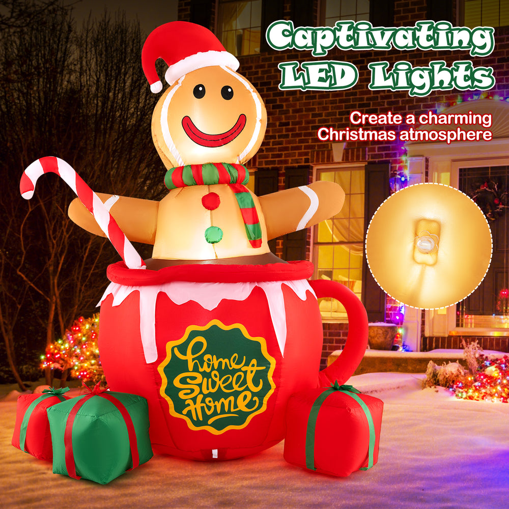 7-foot inflatable gingerbread man in hot cocoa mug with LED lights, perfect for charming Christmas garden decoration.